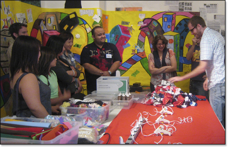 Socks workshop in front of Game of Life mural